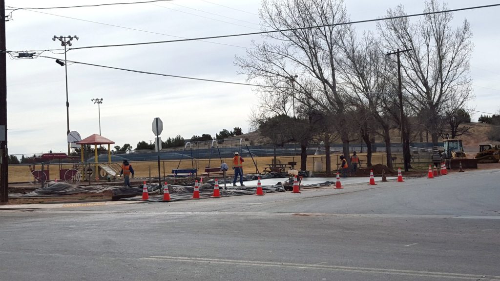 Photo by Naomi HatchCrews pour a cement slab that will provide handicap access to East Taylor Park. The project was funded through Community Development Block Grant the town receives every four years. Handicapped accessibility work was also done at Freeman Park.