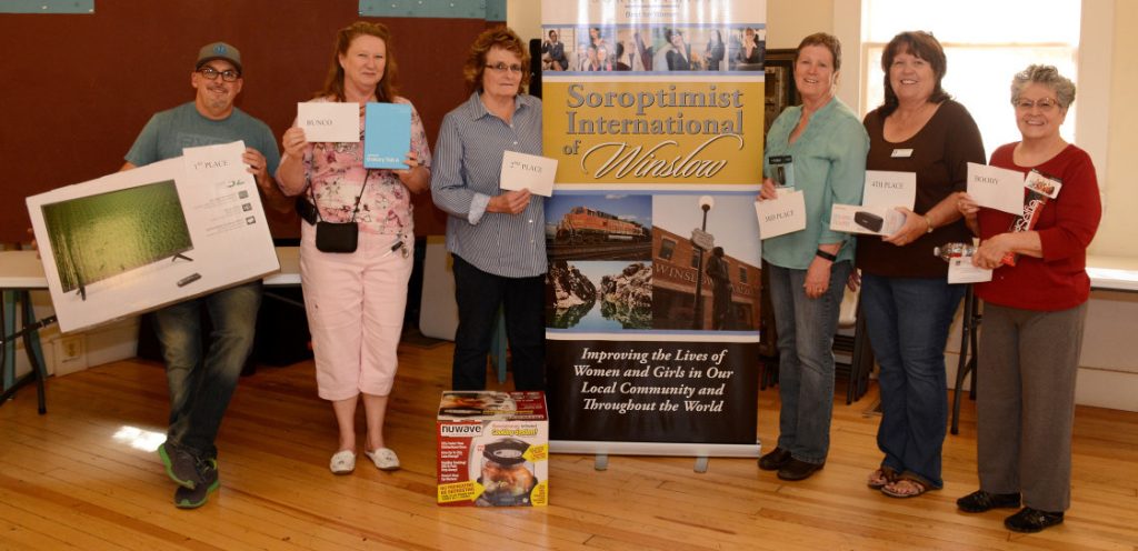 Photo by Misty Benham/mistybenhamphoto.netWinners at the annual Soroptimist Bunco fundraiser included (left to right) Mike Day, who received a Vizio 32” TV for first place; Berry Larson, Samsung Galaxy tablet as Bunco prize; Pat Engelhardt, Nuwave for second place; Sandy Light, Fitbit for third place; Sylvia Hartnett, wireless speaker for fourth place; and Dee Rodriguez, selfie stick as Booby Award. The event was held April 2 at the Winslow Chamber of Commerce and was a great success, drawing 48 players.