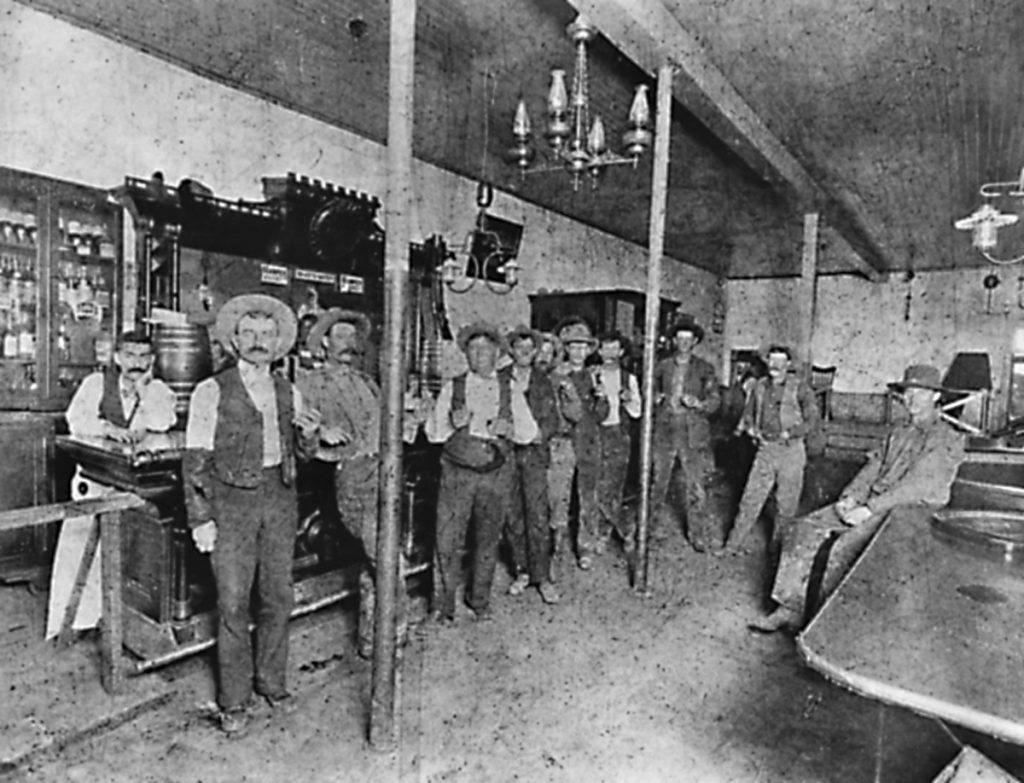 Photo courtesy of Steve PaukenTaken in 1899 at the Fashion Saloon in Winslow, this photo includes several Hash Knife cowboys. The men are identified as (left to right) bartender Mike Oyster, Lucien Creswell, Bill Balcom, Frank Black, Cap Begnal, Tom Williams, George Hennessey, Ed Bargman, Doug Johnson, Frank Dane and Johnny Hoffman.