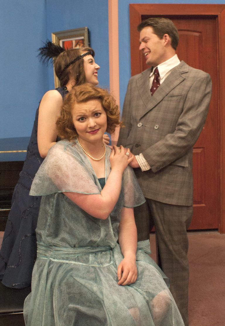 Photo courtesy of Northland Pioneer CollegeMarie-Louise Durham (Kara Hunt) is having an affair with John Middleton (Ethan Jackson) literally behind the back of John’s wife Constance (Shannon Green), The Constant Wife in W. Somerset Maugham’s debonair comedic play of civilized marriage--and civilized love--the spring production by Northland Pioneer College’s Performing Arts Department. Performances will be at 7 p.m. Thursdays through Saturdays, April 21-23 and 28-30, with additional matinees at 2 p.m. on April 23 and 30, in the NPC Performing Arts Center on the Snowflake/Taylor campus. Advance tickets are $6, or $8 on the day of the performance, with a $1 discount for NPC students, staff and senior citizens. Tickets for The Constant Wife are available by calling the box office at (928) 536-6250 or can be ordered online at www.npc.edu/tickets. Performances will be done “in the round,” with seating limited to 50 for each performance.