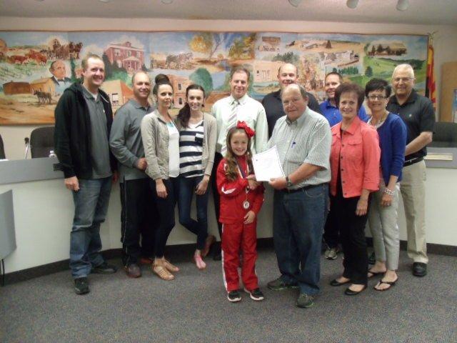 Photo by Naomi HatchKenadi Stuart (front, left) was honored by the Snowflake Town Council and Mayor Tom Poscharsky (front, right) last week for her success in the Elks Hoop Shoot competition. Offering their congratulations are (back, left to right) Councilman Cory Johnson, Kenadi’s parents, Ryan and Misty, her sister Brookelyn, Councilmen Byron Lewis, Stuart Hensley and Lynn DeWitt, and Kenadi’s grandmother, aunt and grandfather, Joy Harris, Cindy Petersonand Monty Harris.