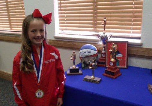 Photo by Naomi HatchKenadi Stuart shows off the trophies she won by taking first place in the Elks Hoop Shoot at the school level in her age group, first at the lodge shoot in Show Low, first in the district at Camp Verde and first at state. She took third place in the Western Regional Shoot in Las Vegas.