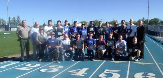 Photo by Naomi HatchMembers of the Navajo County Board of Supervisors and other county officials presented certificates and will present medals to each member of the Snowflake High School Track Team, Arizona State Champions for Division III. Board Chairman Jason Whiting acknowledged the hard work the young athletes put in each day, as well as their dedication. He commended them for the unusual way they connect with the community, noting that they took the widows on a date for Valentine’s Day. Whiting told them that it is wonderful to win gold medals, but that to have the integrity that they have is worth much more. Those on hand for the presentations included (front row, left to right) Sheriff KC Clark, District III Supervisor Jason Whiting, Luke Craun, Kendal Kay, Maser Willis, Bryce Palmer, Kadyn Davis, Jake Hall, Jordan Gardner, Dallin Chapman, (back row) Coach Lyndsay Lyman, Coach Joe Claire, Justin Webber, Tanner Beatty, Brady Petersen, Ban Taylor, Kegan Bjornn, Dylan Richards, Dylan Kay, Tanner Willis, Kurt Wood, Coach Ashley Davis and County Attorney Brad Carlyon.
