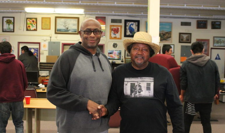 Photo by Talaina FisherHolbrook Mayor Bobby Tyler meets with Arizona Blues Hall of Famer Tommy Dukes after his performance at the Phenix School May 18. Dukes and teacher James Cox, who also performed with the musician, treated the students to a chili dog lunch.