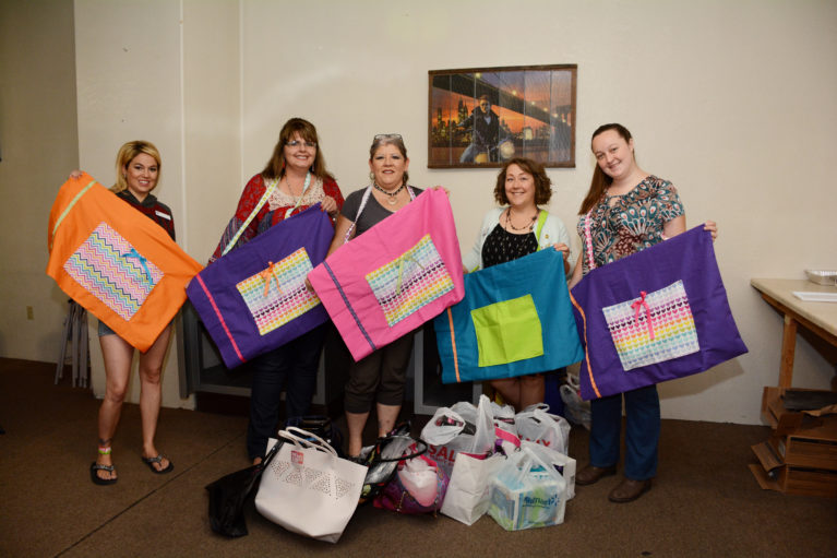 Photo by Misty Benham/mistybenhamphoto.netMembers of Soroptimist of Winslow invited Tracey Crisp and Anna Weidler of the Department of Child Safety to their June 16 meeting. The DCS ladies informed the members about what they do, as well as supplies that are needed for children and teenagers in the community. Club members Paula Vargas, Katie Sanchez (left), Paula Vargas (center) and Daniella Day (second from right) presented a donation of various items to DCS, including curling irons, blow dryers, make-up, handbags, personal hygiene products and handmade travel pillowcases to Crisp (second from left) and Weidler (right). They were thrilled, because these items are needed by the organization.