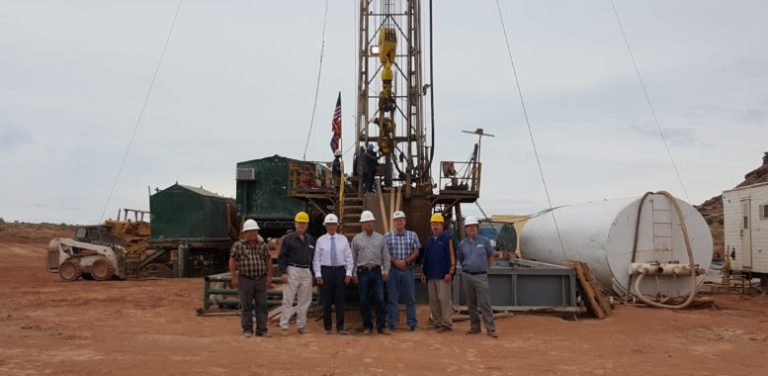 Photo courtesy of Blackstone Exploration CompanyFollowing discussion of the developments of Blackstone Exploration Company, (left to right) Blackstone board member Loren Glick, Arizona Oil and Gas Conservation Commission Chairman Frank Thorwald, Blackstone President Carmon Bonanno, Rocking Chair Ranch President Bill Elkins, Arizona State Land Department Mineral Section Manager Joe Dixon, Navajo County Manager James Jayne and former Arizona Geological Survey administrator Nyal Niemuth stand in front of Blackstone’s Drilling Rig 1.