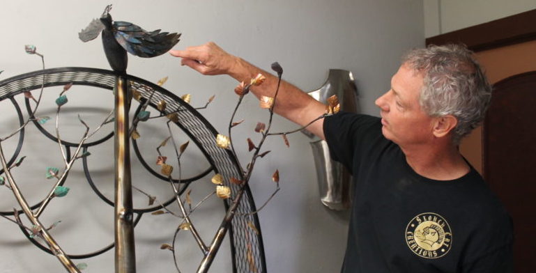 Photo by Linda KorHoward Noble rolled metal to build this tree, adding copper leaves to represent the four seasons. He also hand fashioned the bird and other wildlife as part of the sculpture.