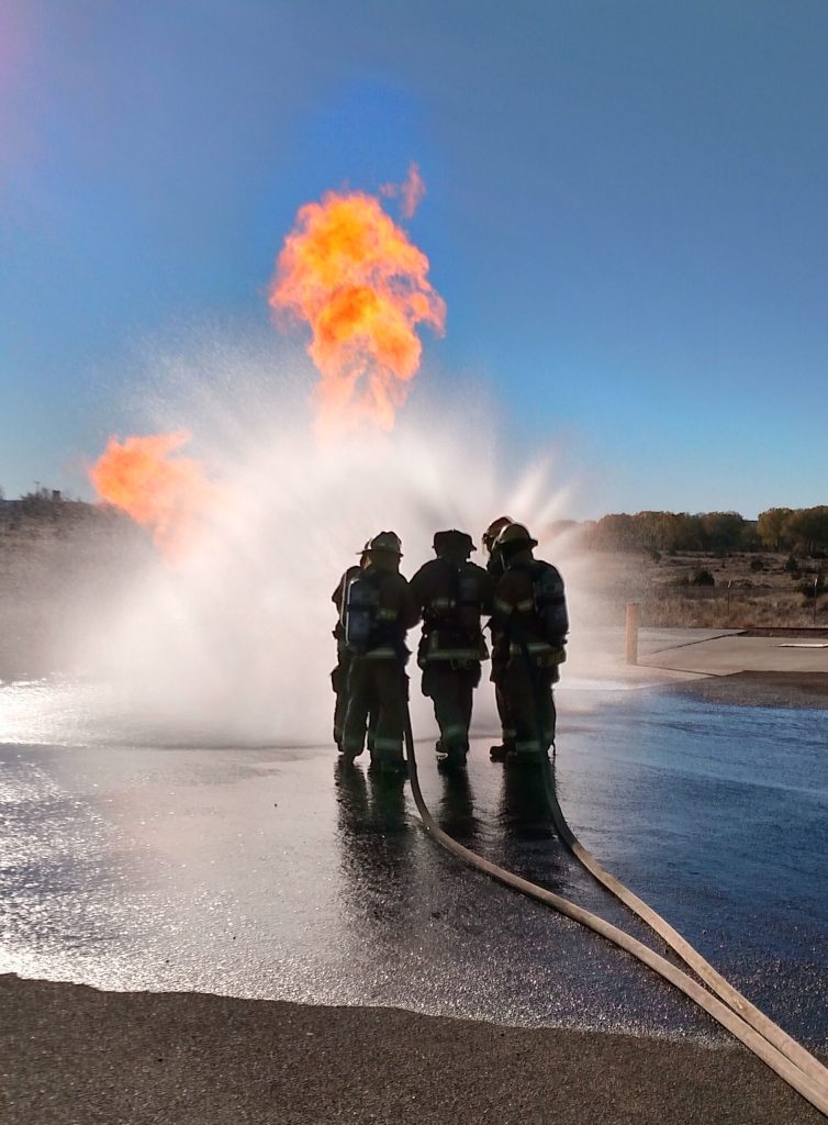 Photo courtesy of the Northeast Arizona Training CenterFire science students gear up and train in a variety of scenarios that involve combating simulated fire using state of the art technology, live fire incident and rescuing people caught inside a blaze.