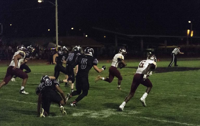 Photo by Rich LarsonWinslow Bulldogs go for two points and the lead in last Friday night’s football game with Blue Ridge. Titus Russell (11) jumps high in the air to catch the pass to give the Bulldogs the edge they needed to win the game 8-7.