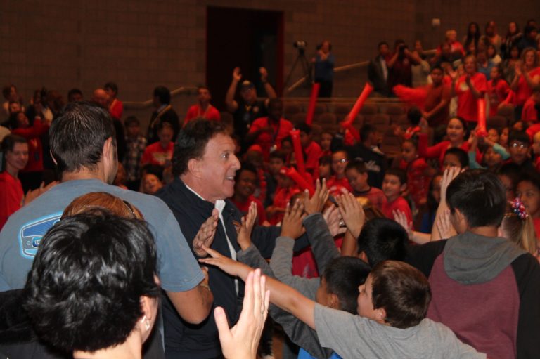 Photo by Linda Kor - Jake Steinfeld, chairman of the National Foundation for Governors’ Fitness Councils, gets a warm welcome from students at the George Gardner Performing Arts Center during a celebration of the new Don’t Quit Fitness Center at Hulet Elementary School.