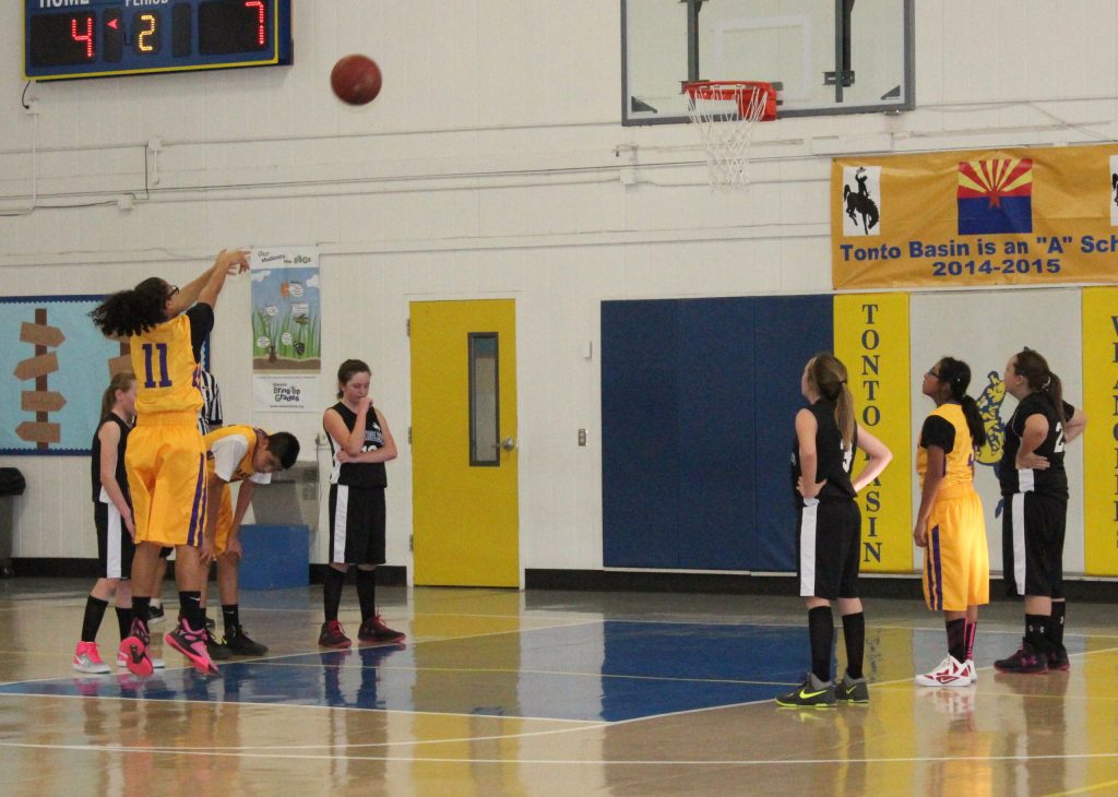 Photo courtesy of the Native American Christian Academy - Aysa Benally, shown here making free throw when she was a student at the Native American Christian Academy, now attends a private school in Olathe, Kan., because a donor took her in to pay for her $14,000 per year education. A freshman, she is starting for the varsity volleyball team that was second in the state of Kansas last year and is currently in the state playoffs after winning the conference title. Benally is also a straight A student at college.