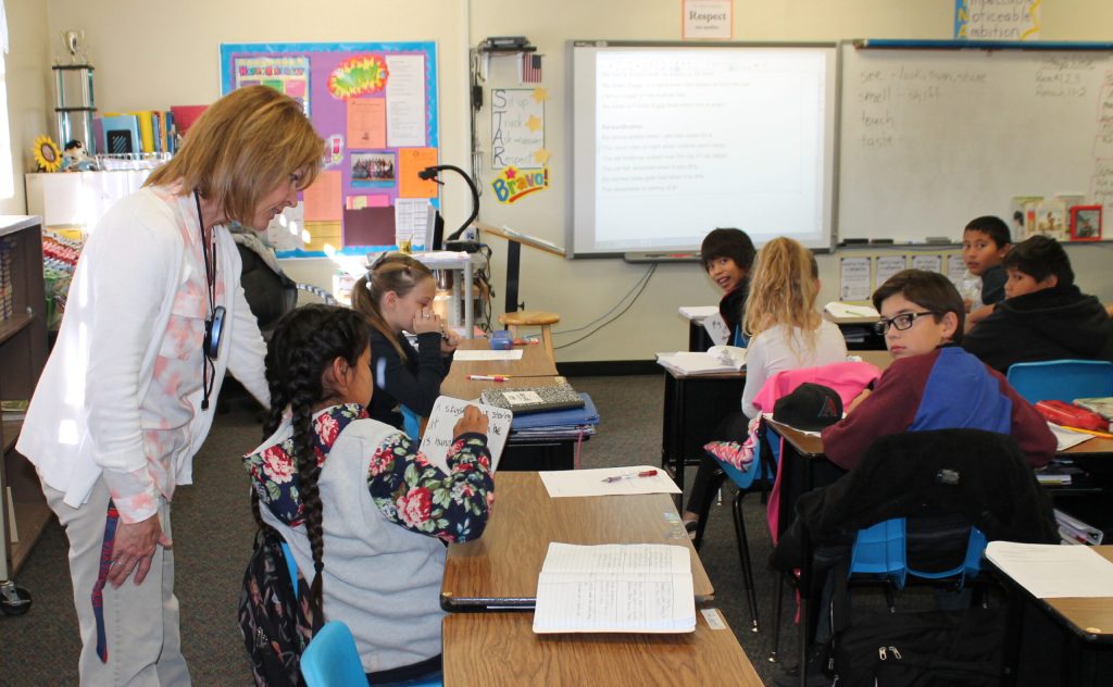 Photo by Linda Kor - Reading Specialist Patty Hansen (left) has taken on the role as teacher of a fifth grade class at Hulet Elementary School in Holbrook. The teacher shortage affecting the Holbrook Unified School District is mirrored across the state and presents challenges to ensuring that children are getting the best possible education.