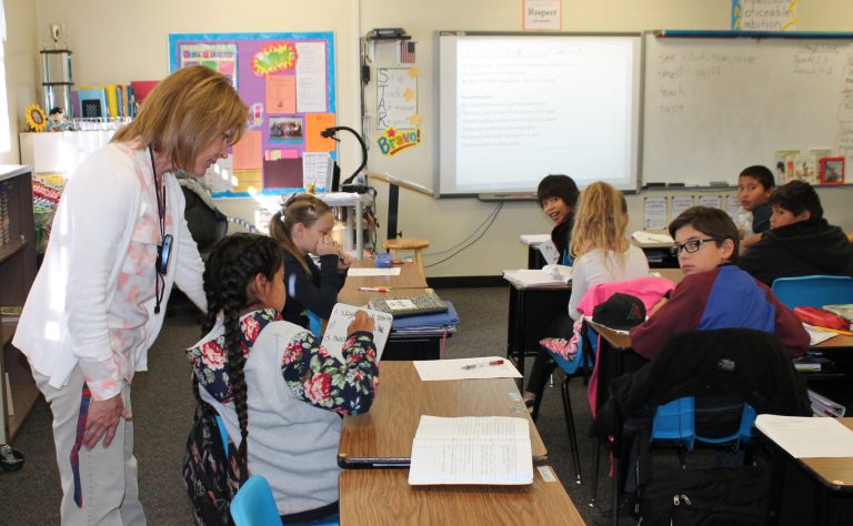 Photo by Linda Kor - Reading Specialist Patty Hansen (left) has taken on the role as teacher of a fifth grade class at Hulet Elementary School in Holbrook. The teacher shortage affecting the Holbrook Unified School District is mirrored across the state and presents challenges to ensuring that children are getting the best possible education.