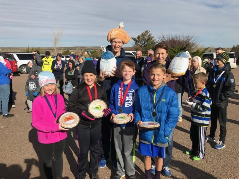 Photo courtesy of the Snowflake High School cross country team -Winners of the Thanksgiving Turkey Trot Men’s and Women’s one-mile race were (front row, left to right) Gracie Lundberg, second place women’s; Claire Hiatt, third women’s; Reaves Hiatt, third men’s; Bergen Bailey, second men’s; (back row) Joseph Peterson, first men’s; and Debra Toya, first women’s.