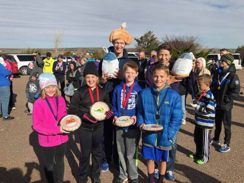 Photo courtesy of the Snowflake High School cross country team -Winners of the Thanksgiving Turkey Trot Men’s and Women’s one-mile race were (front row, left to right) Gracie Lundberg, second place women’s; Claire Hiatt, third women’s; Reaves Hiatt, third men’s; Bergen Bailey, second men’s; (back row) Joseph Peterson, first men’s; and Debra Toya, first women’s.