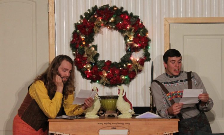 Santa gets some much needed help reading Christmas letters from Gustav, left, played by Carson Saline, and Hans, played by Keagan Bjorn.
