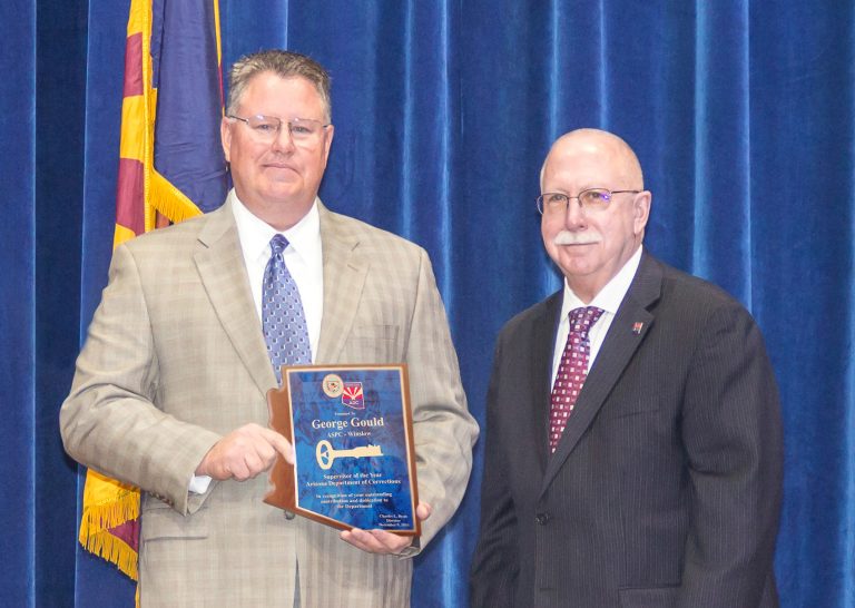Photo courtesy of the Arizona Department of CorrectionsGeorge Gould (left), Criminal Investigations Unit supervisor for Arizona State Prison Complex-Winslow, receives congratulations from Arizona Department of Corrections Director Charles L. Ryan on his selection as 2017 ADOC Supervisor of the Year. With his positive working relationship with Navajo County and the Winslow Police Department, he has been able to prevent contraband from entering the correctional facility. Gould and his team work with state, federal, county and local law enforcement agencies.