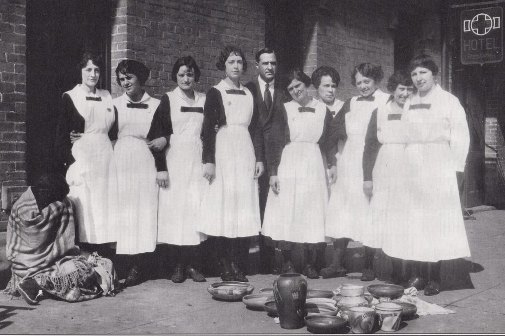 Photo courtesy of the Old Trails MuseumStanding in front of the old Winslow Harvey House in 1918, these young women wore the distinctive black and white uniforms that identified them as Harvey Girl waitresses. On the left is an Indian woman selling her pottery to hotel guests and train passengers. Third from the right is Juanita Gale Creswell, known locally as “Cecil.” She is the only known Harvey Girl to become a cattle rustler.