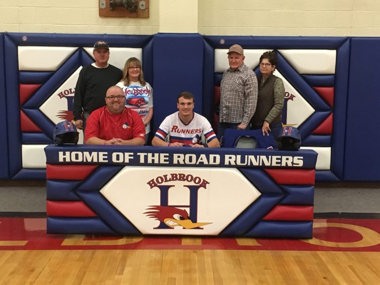 Photo courtesy of Holbrook High SchoolHolbrook High School senior Cade Maestas (center) signs a national letter of intent to play baseball at Mesa Community College, witnessed by (left to right) his parents, Shawn and Donette Maestas, HHS baseball Coach Brady Pond, Cade’s grandparents Chuck and Frances Perkins, and (not pictured) grandfather Leo Maestas.