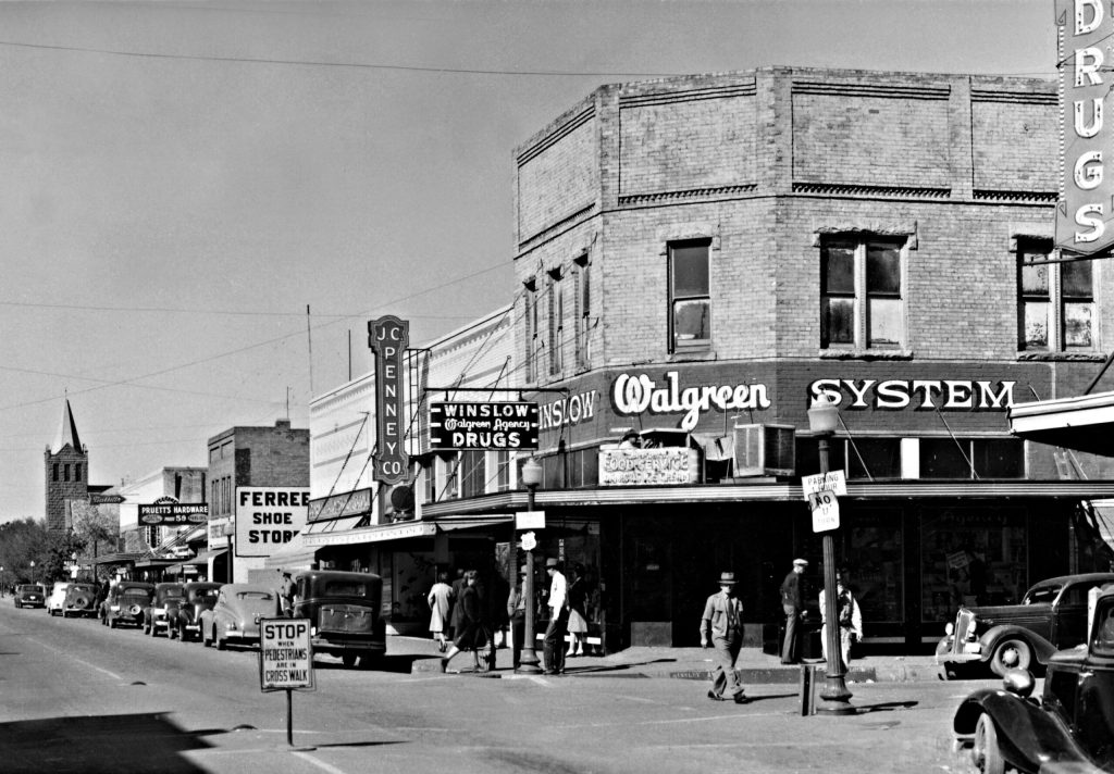 Photo courtesy of Old Trails Museum This westbound scene from a Frashers Fotos postcard shows the famous “corner” intersection in downtown Winslow during the 1940s.