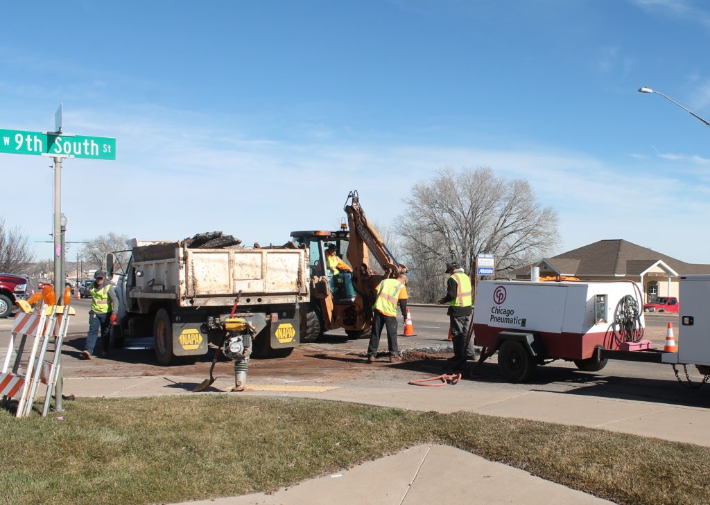 Photo by Chanae NielsonMike Rogers, Dan DeWinter, Dustin Rogers and Terrin Smith of the Snowflake Public Works Department repair a broken water main on the corner of Ninth and Main in Snowflake Jan. 30 following weekend repairs to another break in the aging water main two days earlier, which kept the crew working until 3 a.m.