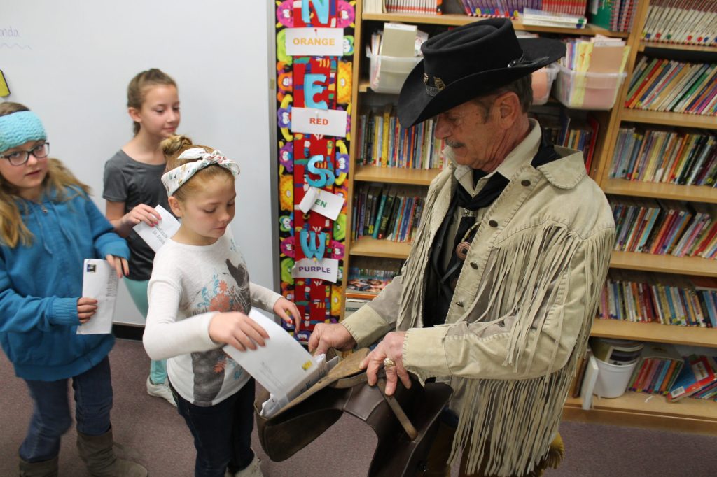 Hashknife Posse riders made their way to schools throughout the area in the week before the Pony Express ride. Frank Zuicarelli holds the mailbag while Joseph City Elementary fourth graders (left to right) Jorja Hutchens, Aneesia Kissling and Rylan Westover deposit their letters.