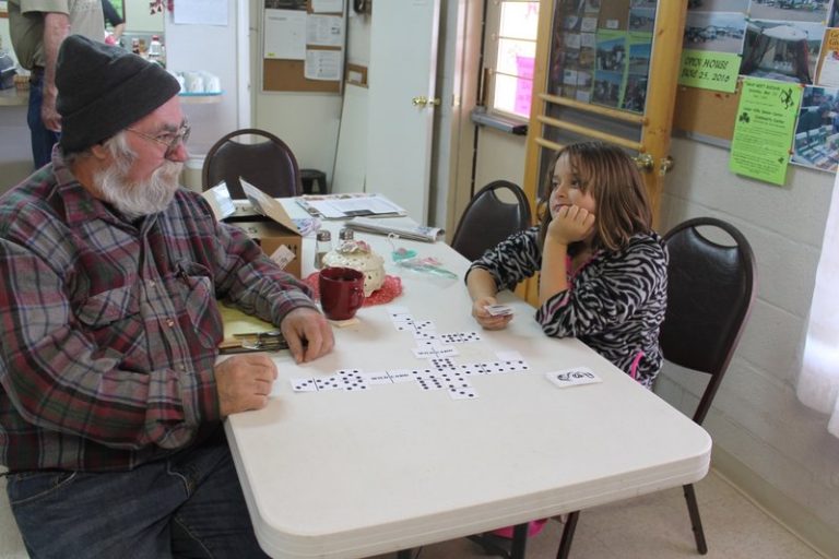 By Chanae NielsonMiranda Bard considers her next move while playing Dragon Train with her grandfather, game inventor Dan Miller, at the Cedar Hills Senior Center.