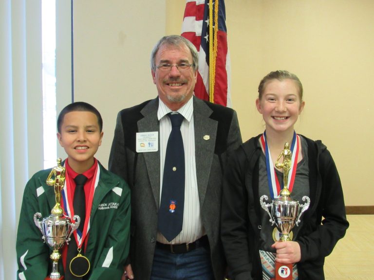 Arizona Elks Association Hoop Shoot Damon Attakai (left) and Mylee Demuth (right) came home champions after their wins at the Region 7 Regional Shoot in Las Vegas. They are pictured here with Gregg Boyce, the AEA Hoop Shoot Director.