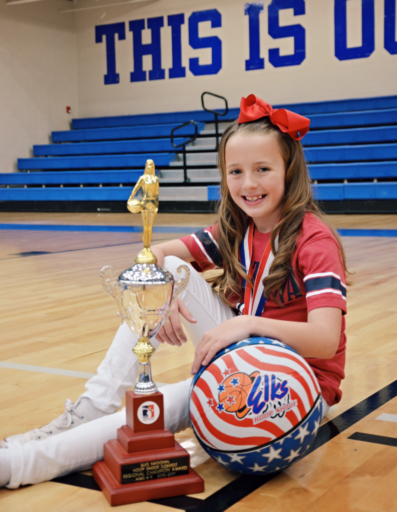 Photo courtesy of Cindy PetersonKenadi Stuart, a student at Snowflake Intermediate School, won the first place title in the West Regional Hoop Shoot held in Las Vegas, Nev. on Feb. 25. She competed against teens from California, Hawaii, Nevada and Utah shooting 21 of 25 to win the title and will represent the West Region in the National Hoop Shoot Competition to be held in Chicago on April 22.