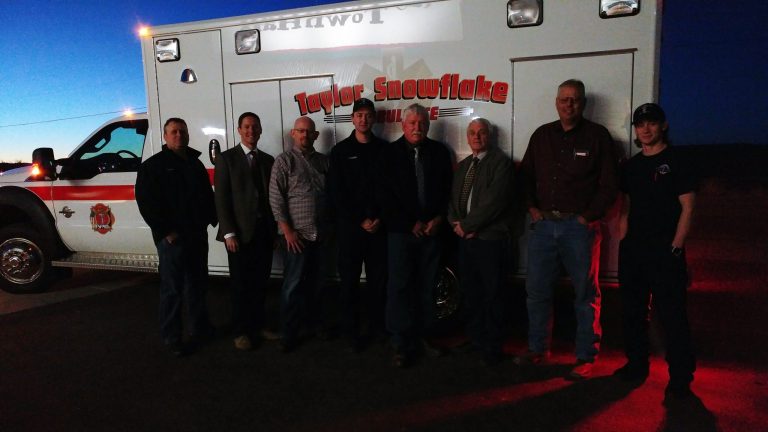 Photo by Naomi HatchThe Taylor-Snowflake Fire & Medical Department recently purchased a new 2016 ambulance. Pictured here with the newly acquired ambulance are (left to right) are Chief Clint Burden, Town Manager Gus Lunderg, Councilman Kyle Peck, Firefighter Delton Woodside, Mayor David Smith, Councilman Fay Hatch, Vice Mayor Shawn Palmer and Firefighter Jace Brewer.