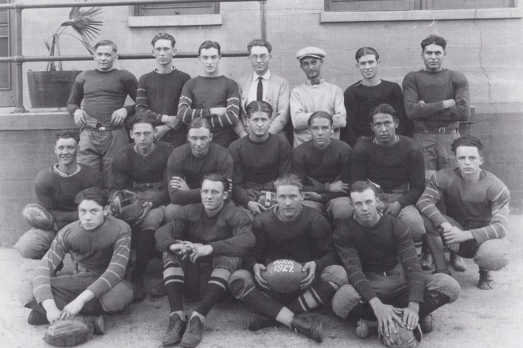 Photo courtesy of the Old Trails MuseumIn the early days the young railroader created rivalries with the other railroad towns. They formed football and baseball teams, calling themselves the Blue Devils, the Cardinals and the Meteorites. Rather than play on grass fields they played in dirt fields and rode the train to places like Ash Fork and Williams to compete. This photo is of the Santa Fe apprentice football team in Winslow in 1927. Among those on the team were Ted McBride, Ray Blumlein, Bill Miley and Manuel Sandoval.
