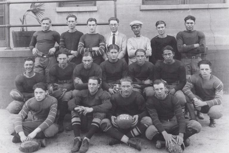 Photo courtesy of the Old Trails MuseumIn the early days the young railroader created rivalries with the other railroad towns. They formed football and baseball teams, calling themselves the Blue Devils, the Cardinals and the Meteorites. Rather than play on grass fields they played in dirt fields and rode the train to places like Ash Fork and Williams to compete. This photo is of the Santa Fe apprentice football team in Winslow in 1927. Among those on the team were Ted McBride, Ray Blumlein, Bill Miley and Manuel Sandoval.
