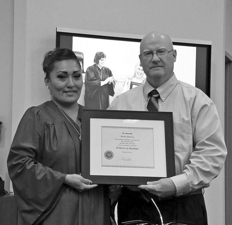 Photo courtesy of Navajo County Drug CourtNaomi Johnson (left) is the most recent graduate of the Navajo County Drug Court. She is pictured here with Navajo County Superior Court Judge Dale Nielson.