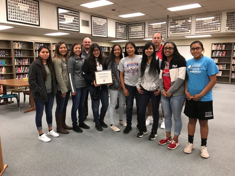 Photo courtesy of Holbrook High SchoolDistrict III Navajo County Supervisor Jason Whiting (fourth from left) stopped by Holbrook High School March 24 to honor the Lady Roadrunners for their final four achievement in the state basketball tournament and present to them with a Certificate of Achievement plaque from the Board of Supervisors. The team includes (left to right) Twyla Clark, Alishea Kee, Dishie Kinlicheenie, Ariyana Pratt, Tristen Ambrose, Tyanna Smith, Tyler Pacheco, Coach Greg Perkins, Madison Chappell and Megan Cummings.