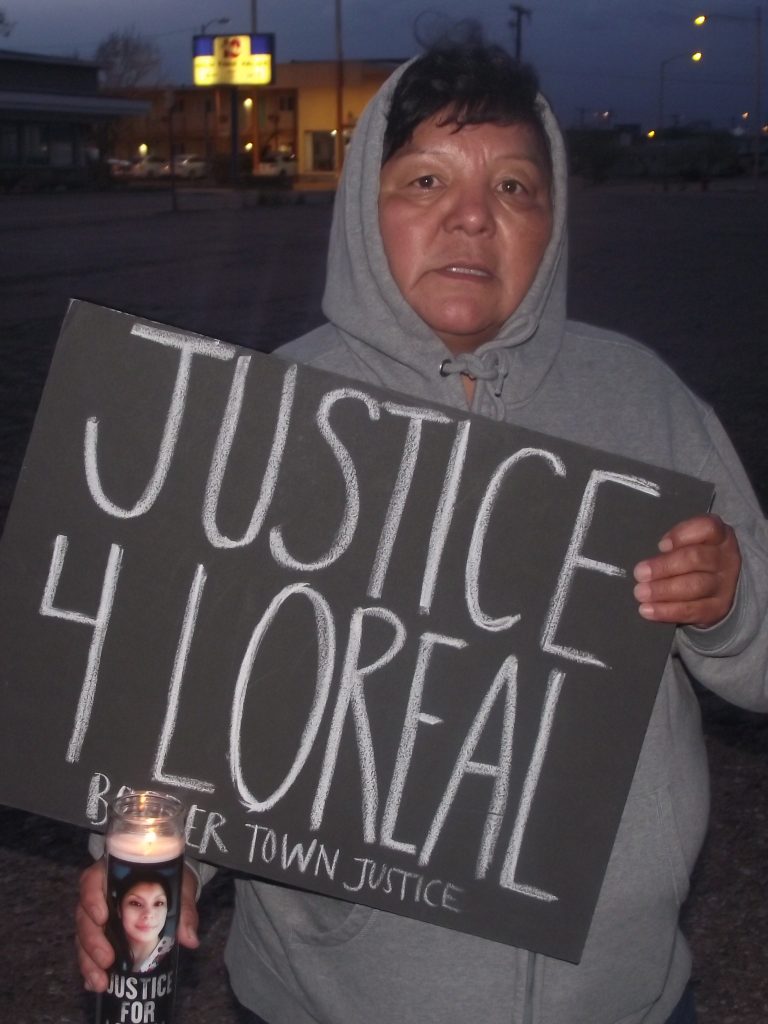 Photo by L. ParsonsMourners and supporters of the Justice for Loreal Movement, including this woman, marched from Winslow City Hall to the Winslow Police Department March 27 to mark the one year anniversary of the shooting death of Loreal Tsingine. Approximately 25 people were in attendance to hear family members and Brandon Benallie of the Bordertown Justice Coalition speak about the ongoing call for an independent investigation into her death.