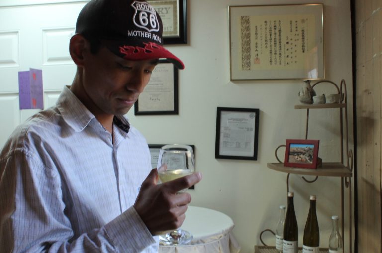 Master brewer Atsuo Sakurai analyzes a sample of his Arizona Sake, which is brewed and distributed in Holbrook, and the only sake brewed in Arizona by a first grade Japanese brewer.