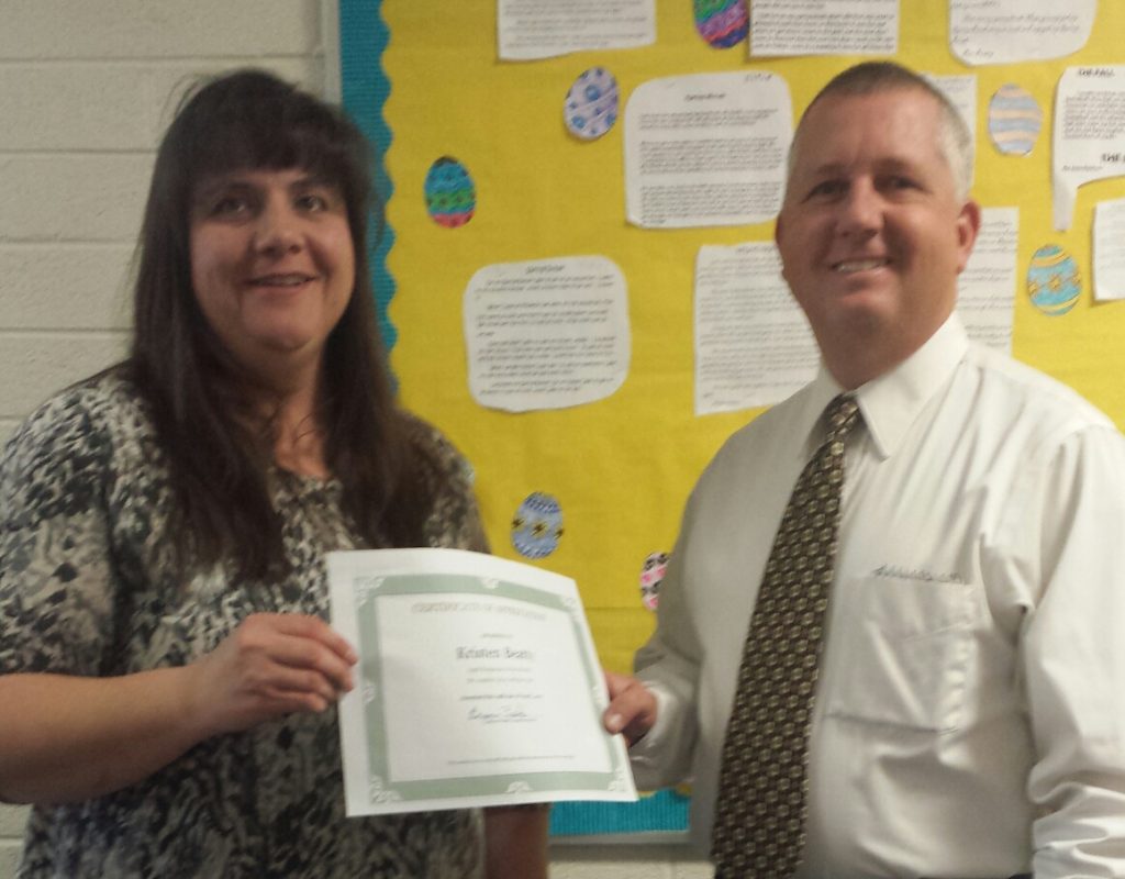 Photo courtesy of Joseph City School DistrictThe Joseph City School board recognized Joseph City Elementary School fourth grade teacher Kristen Beatty (left) as Employee of the Month for going above and beyond the call to serve her students. Presenting the award was JCES Principal Daniel Hutchens (right).
