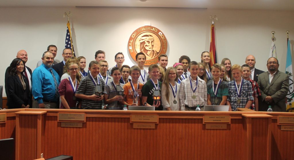 Photo by Linda KorSnowflake Junior High School students were honored at the Navajo County Board of Supervisors meeting last week for the wildlife detection system they developed. District III Supervisor Jason Whiting presented each student who worked on the wildlife detection system with a medallion for participation in the project.