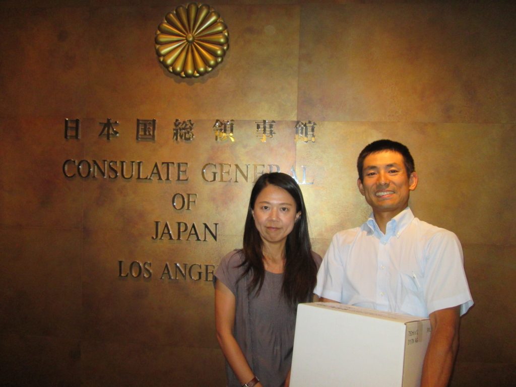 Courtesy photoArizona Sake brewer Atsuo Sakurai of Holbrook recently made his second trip to the Japanese Consulate in Los Angeles, Calif., this time to deliver his sake so that it may be served at consulate receptions. Sakurai (right) made the presentation to Noriko Shimauchi (left) of the Japanese Consulate.