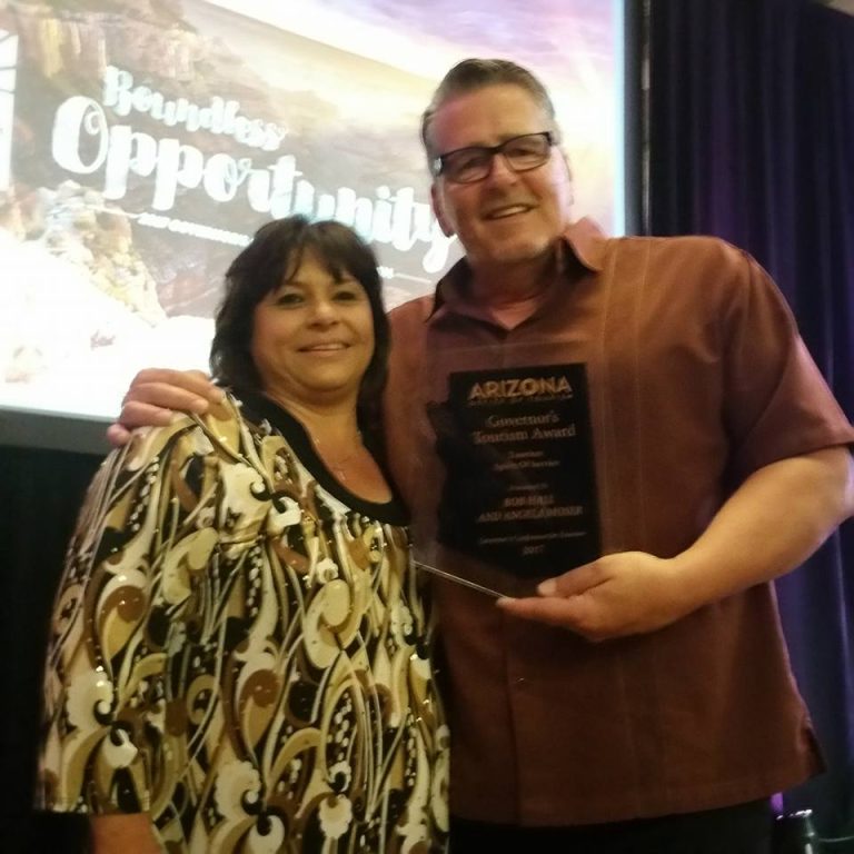 Photo courtesy of the Winslow Chamber of CommerceWinslow Chamber of Commerce CEO Bob Hall (right) and Chamber Assistant Angela Moser (left) were awarded the prestigious Tourism Spirit of Service Award at the recent Governor’s Conference on Tourism.