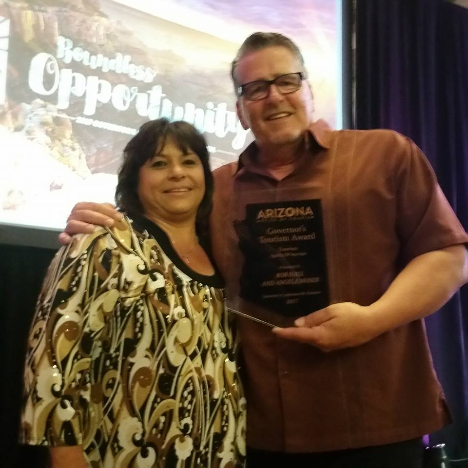 Photo courtesy of the Winslow Chamber of CommerceWinslow Chamber of Commerce CEO Bob Hall (right) and Chamber Assistant Angela Moser (left) were awarded the prestigious Tourism Spirit of Service Award at the recent Governor’s Conference on Tourism.
