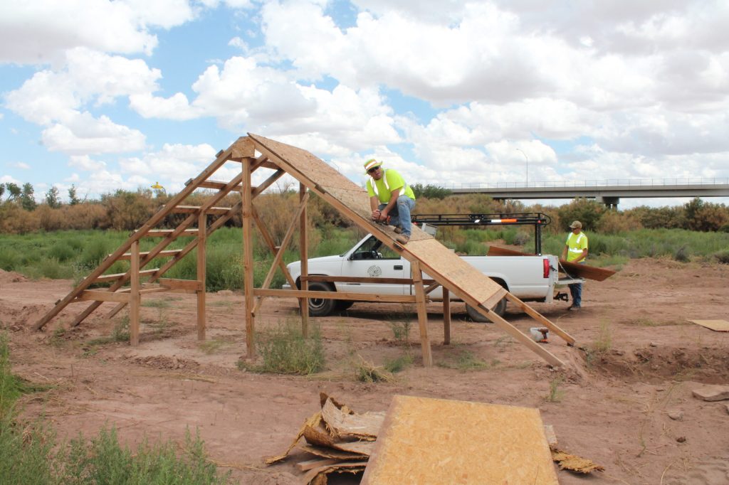 Photo by Linda KorThis weekend will bring some fun in the mud at the third annual Dirty Bird Mud Run on Saturday, Aug. 19, in Holbrook. City Manager Randy Sullivan (left) and employee Michael Young (right) put together a climbing obstacle, one of 18 in the two-mile-plus course. To register for the run, contact Kathleen Smith at 524-6225.