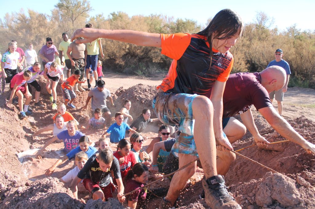 Photo By Linda KorMore than 100 people showed up last Saturday to participate in Holbrook’s annual Dirty Bird Mud Run. Friends, family and neighbors made their way through more than two miles of mud and obstacles, with volunteers on hand to cheer them on.