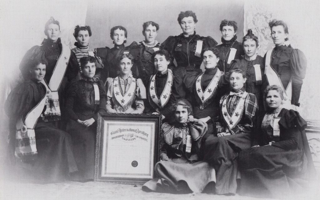 Photo courtesy of the Old Trails MuseumThe wives of railroaders faced some tough times in early day Winslow. They scrubbed the overalls that had been worn on an engine or in the roundhouse, and battled against dust storms that ruined their labors. They missed their families back home, and longed for trees and flowers in the red dirt yard. To create a sisterhood among their fellow railroader wives, they formed networks and societies such as the Railroad Ladies Auxiliary shown here with their new charter on June 14, 1897.