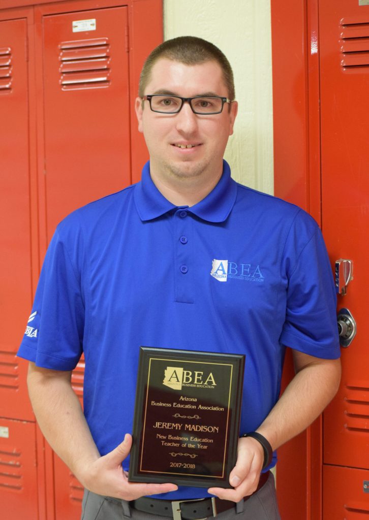 Photo courtesy of Holbrook High SchoolHolbrook High School business teacher Jeremy Madison displays the plaque he received as the Arizona Business Education Association’s New Business Education Teacher of the Year for 2017-18.