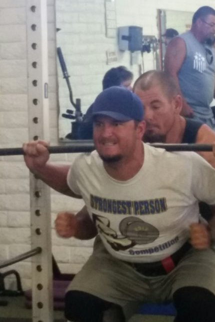Photo courtesy of the City of HolbrookBrandon Queen (right) spots Daniel Pecotte (left) as he performs squats during Holbrook’s Strongest Person Competition.