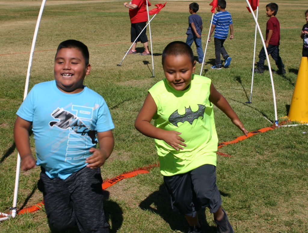 Photo by Daniel Adamovich, PhDStudents at Park Elementary School in Holbrook, including Carlos Aguilar Ruiz (left) and George Ben (right), got their exercise last week when they took part in a fun run. The kids are learning how to develop healthy habits for exercise and eating that will help them develop strong bodies and strong minds.