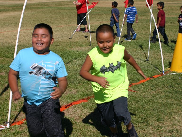Photo by Daniel Adamovich, PhDStudents at Park Elementary School in Holbrook, including Carlos Aguilar Ruiz (left) and George Ben (right), got their exercise last week when they took part in a fun run. The kids are learning how to develop healthy habits for exercise and eating that will help them develop strong bodies and strong minds.