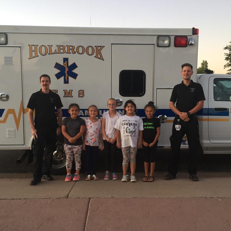 Photo courtesy of Deena Gillespie Holbrook EMS EMTs Nathan Toews (left) and Greg Arnold (right) recently visited with the Brownie Scouts of Troop No. 6542 of Holbrook, including (second from left to right) Emily Sanchez, Tia Gillespie, Daphne Boyle, Salma and Ziva Johnson. The EMTs went over the first aid kits the girls made the week prior, explained some first aid situations and let the girls tour the ambulance. The Brownies have a variety of badges they must earn in a two-year period, and in this session they earned their second badge. Their co-leaders are Monica Sanchez and Deena Gillespie.