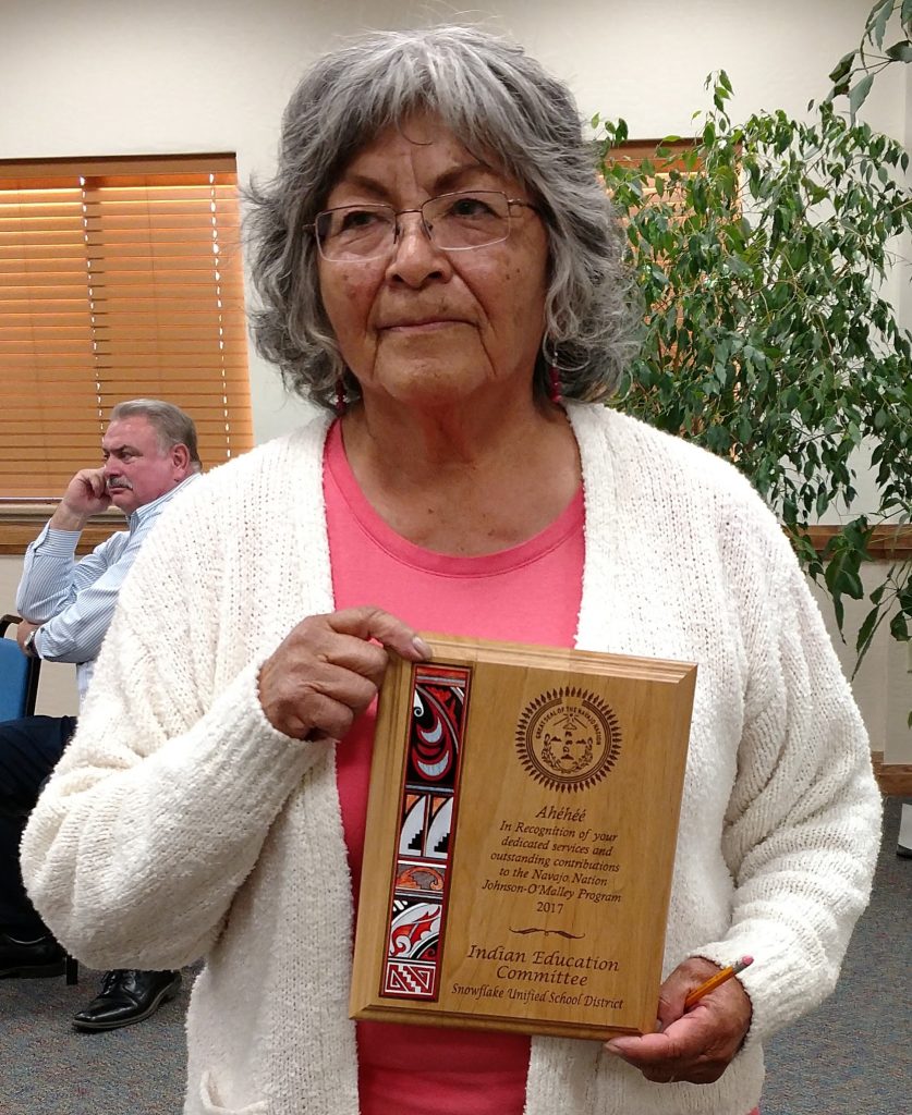 Photo courtesy of the Snowflake Unified School DistrictPat Evans, the Indian Education Coordinator for the Snowflake Unified School District, displays the plaque showing the district’s Indian Education Program was formally recognized by Navajo Nation for “dedicated services and outstanding contributions.”